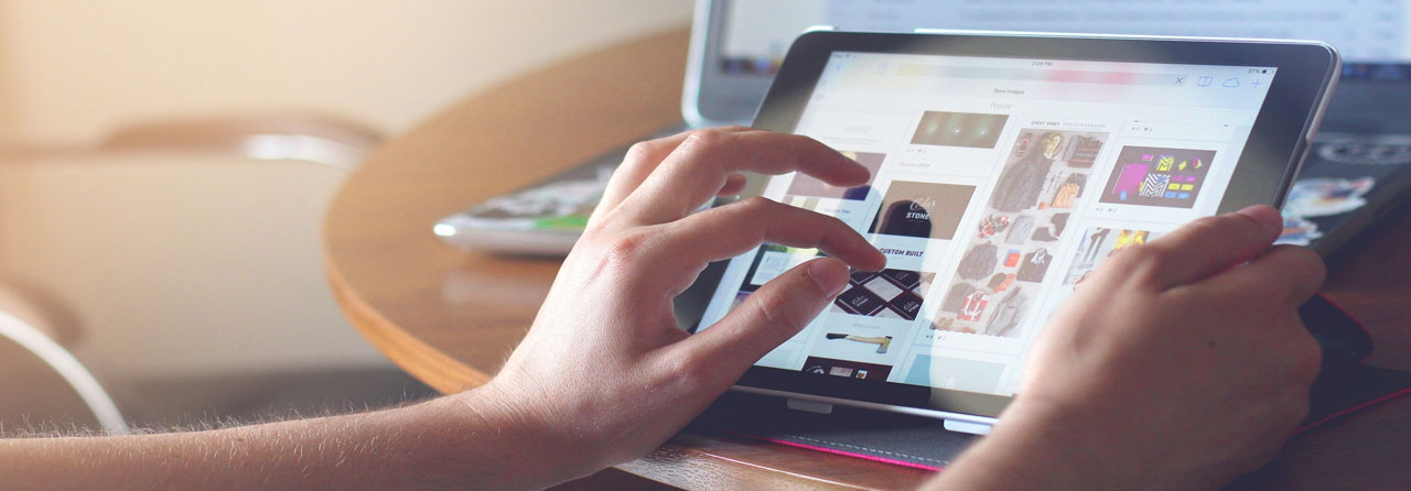 Individual Engaging with an E-commerce Platform on a tablet.